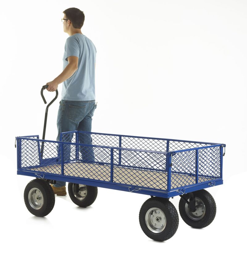 Person pulling a blue mesh-sided platform trolley with four wheels.
