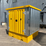 Yellow and galvanised corrugated storage container on a bunded base.
