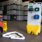 Yellow mobile spill station with first aid and eyewash modules and a small spill